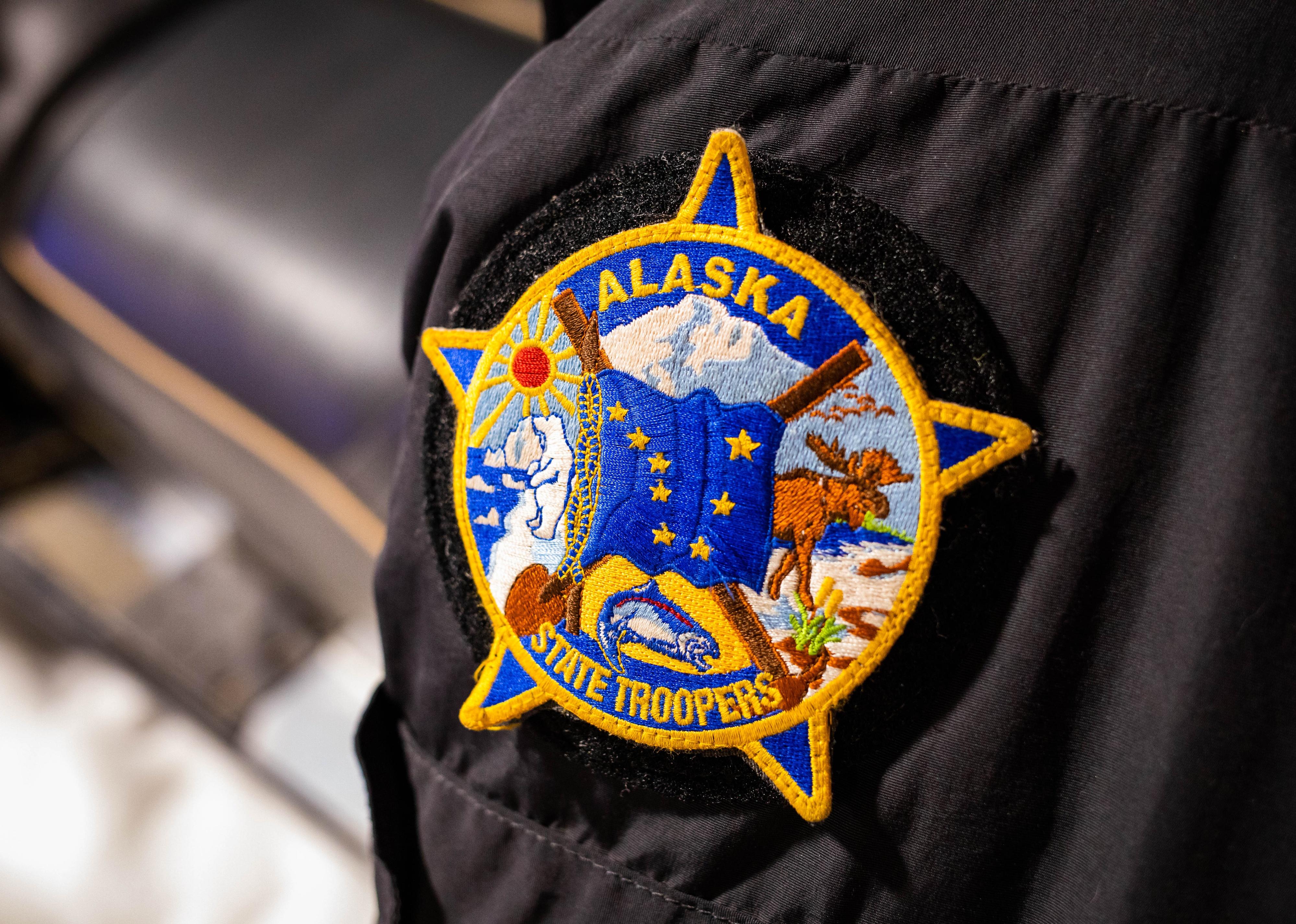 Alaska state trooper official batch icon on clothes close up.