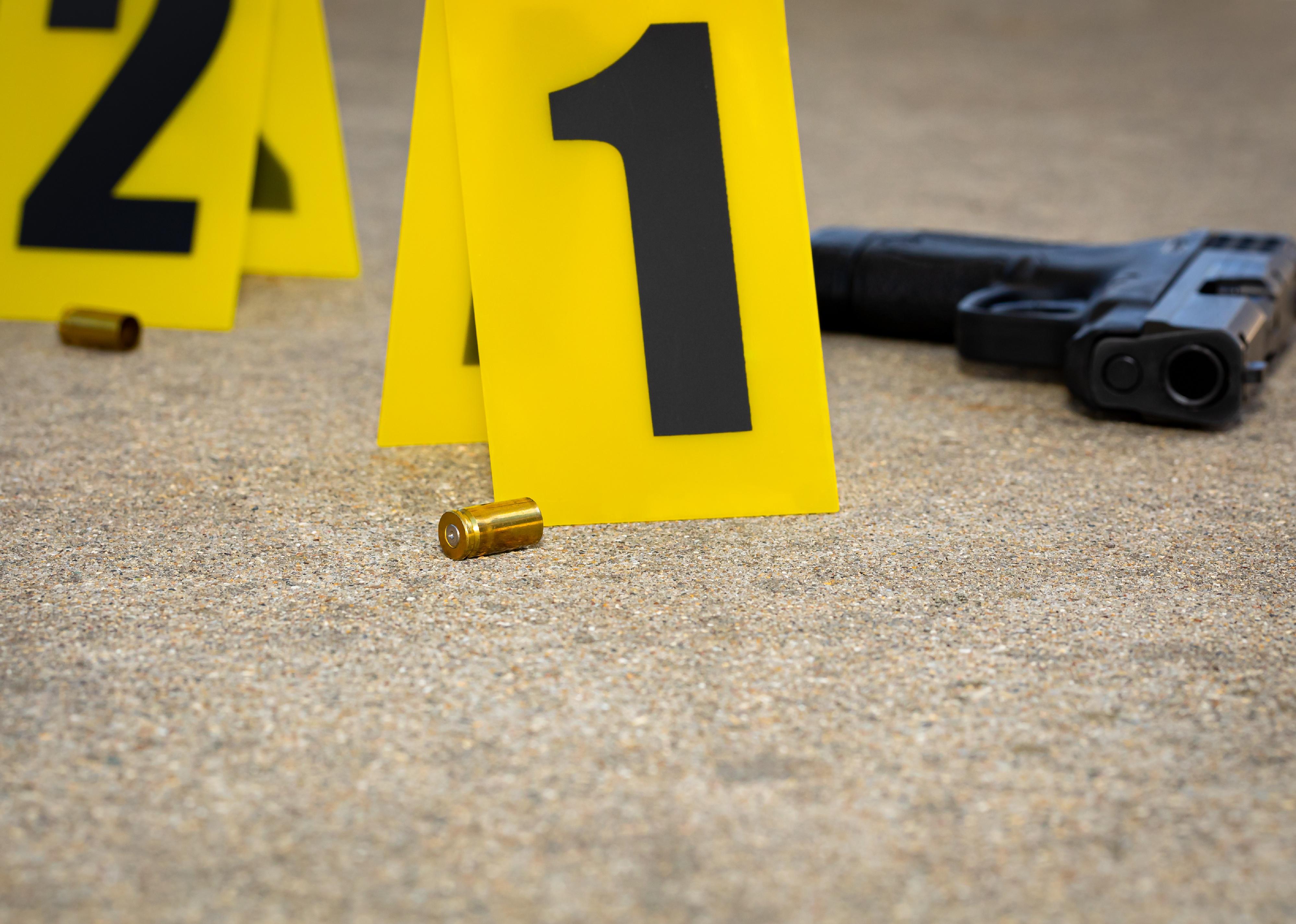 Gun shell casing at crime scene.