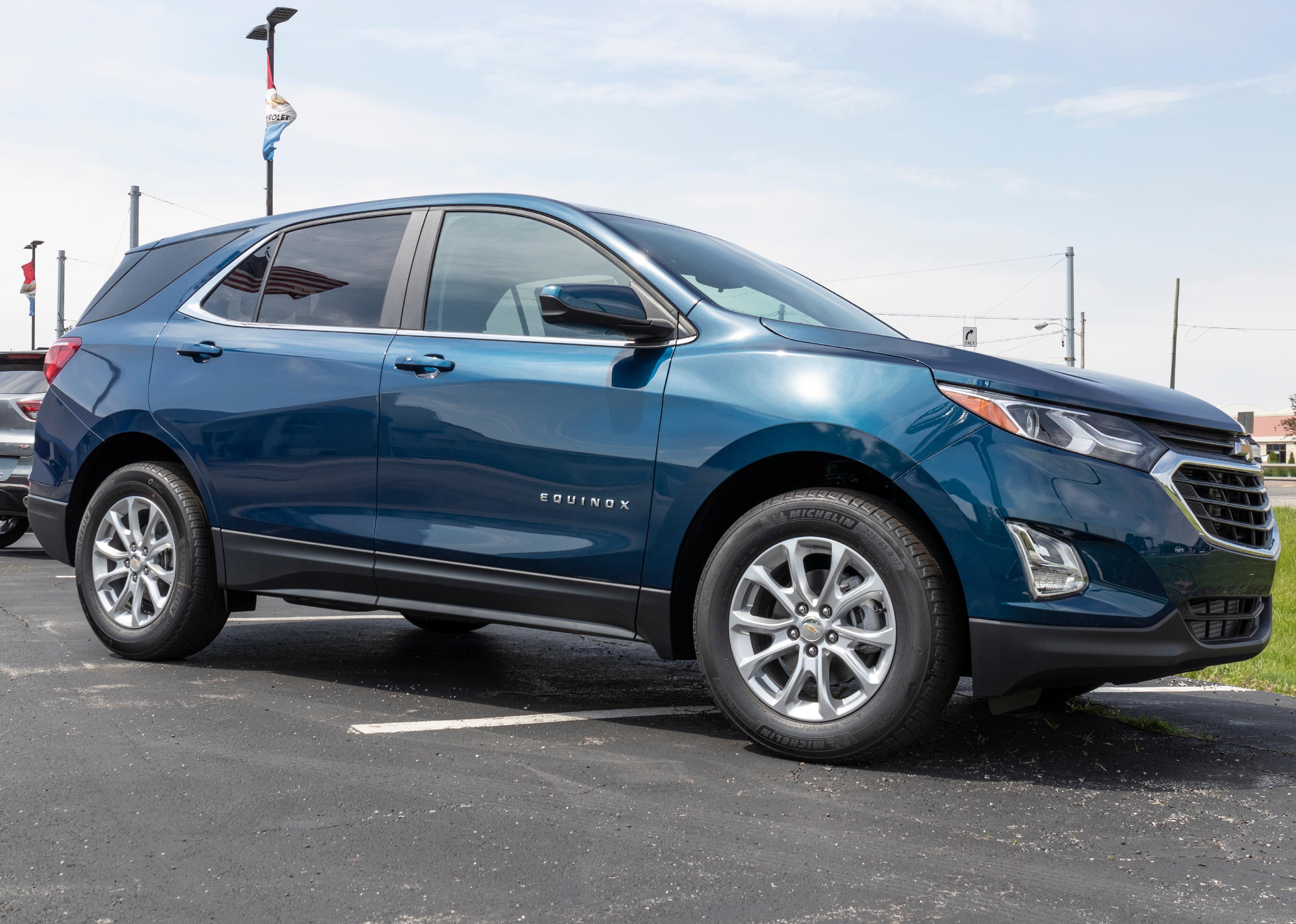 Chevrolet Equinox SUV on display in parking lot.