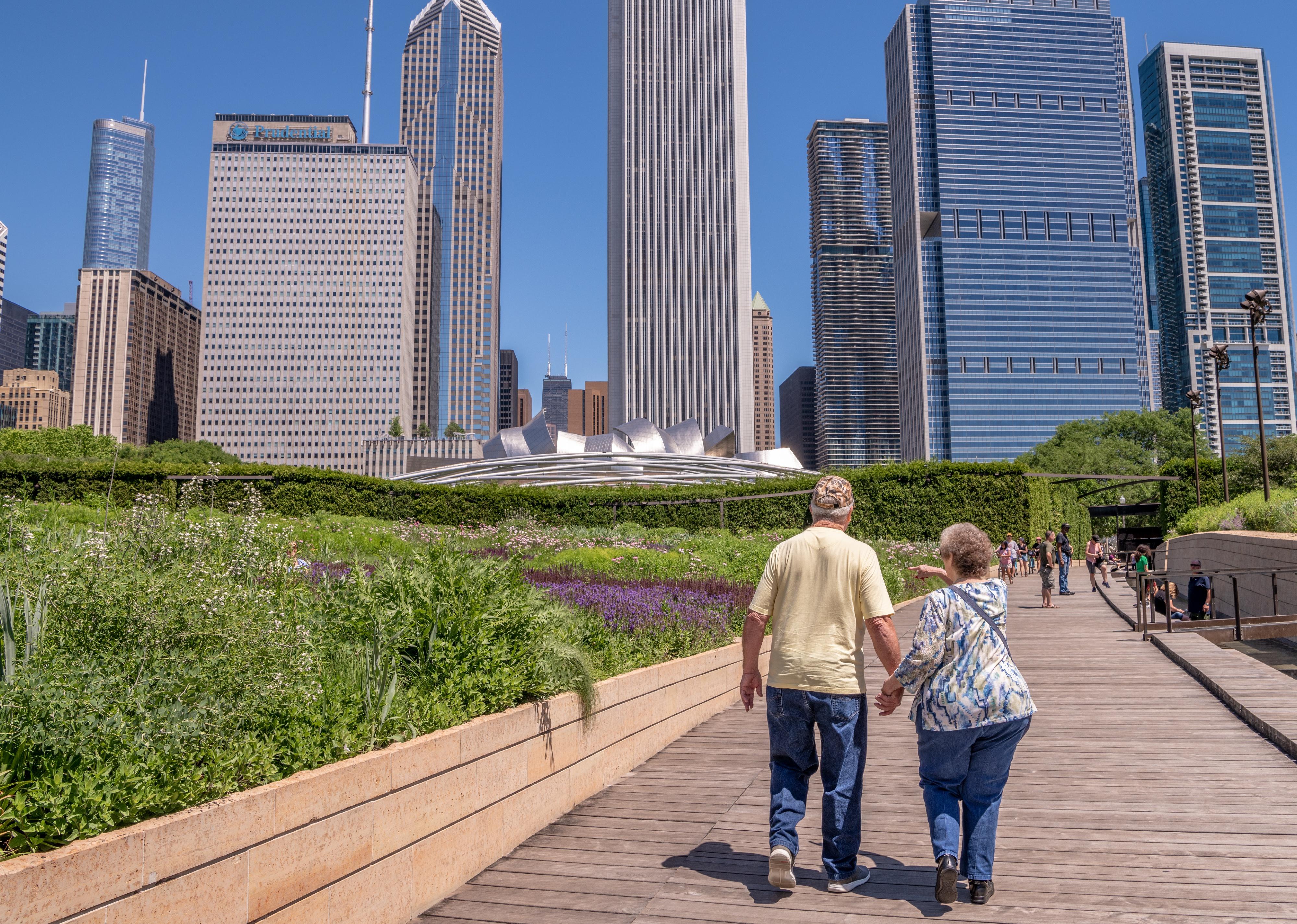 Senior couple walking in Millennium Park.