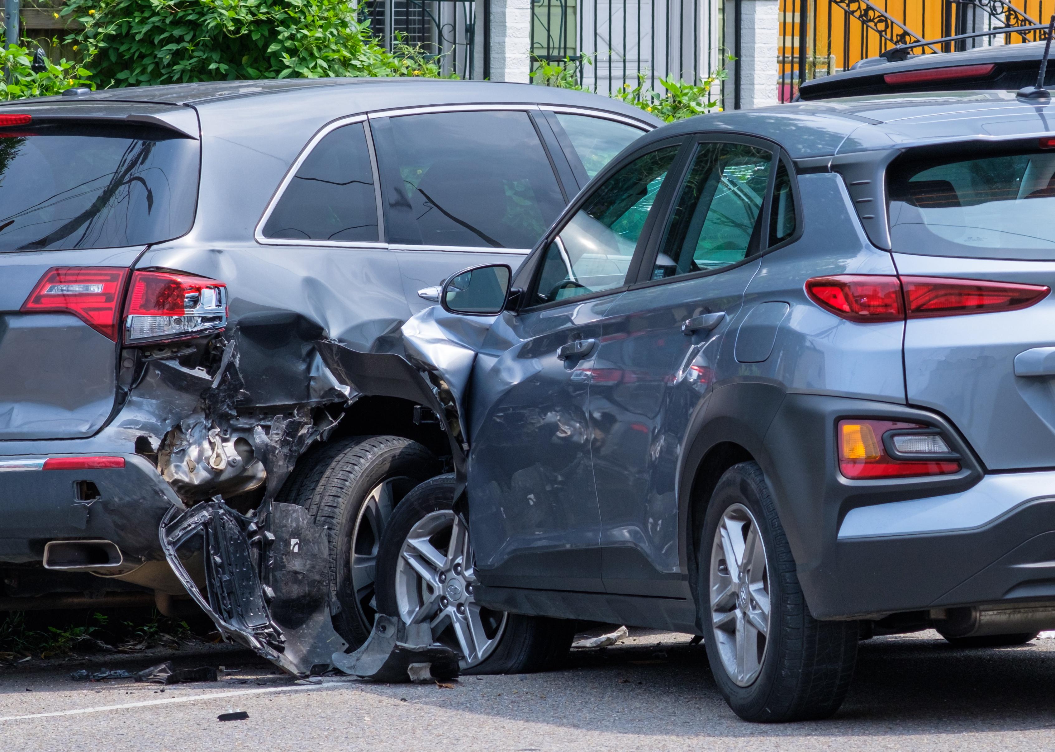 Car crashed into parked car on neighborhood street.