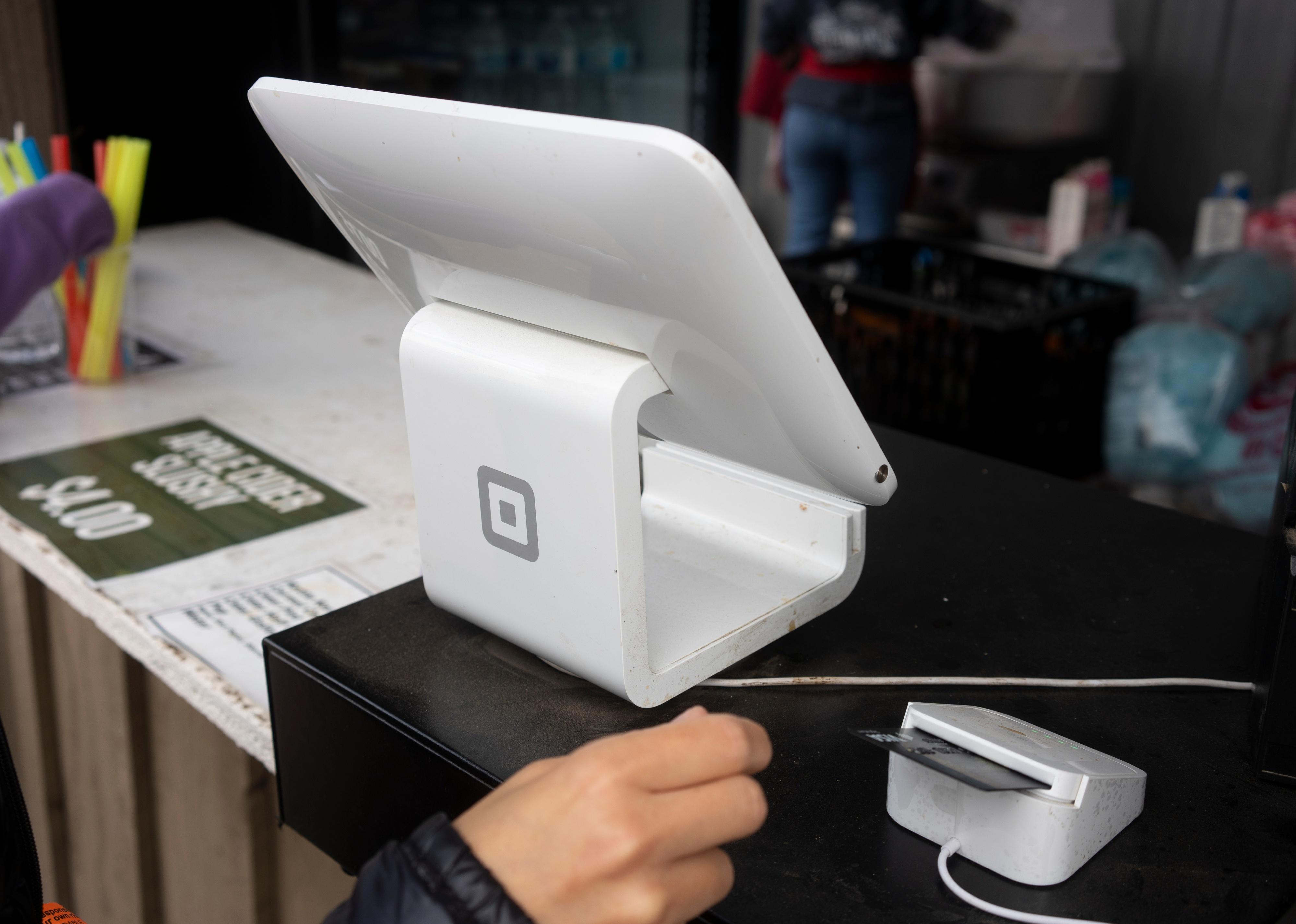 A Block branded POS stand with a chip card reader.