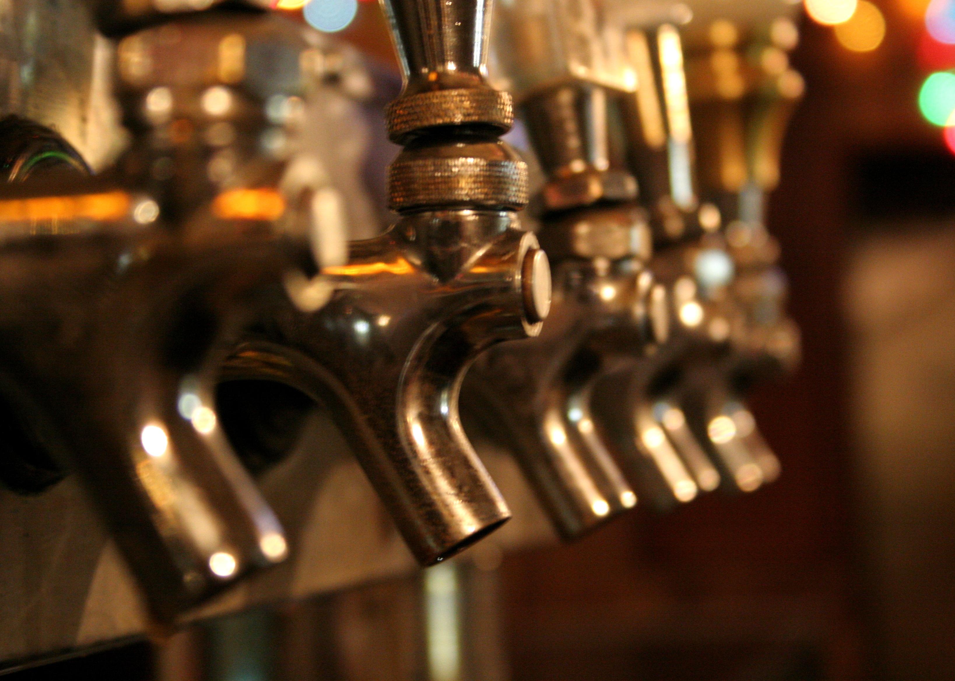 Closeup of taps in a bar