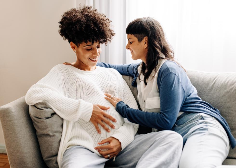 Female parents-to-be sitting together at home