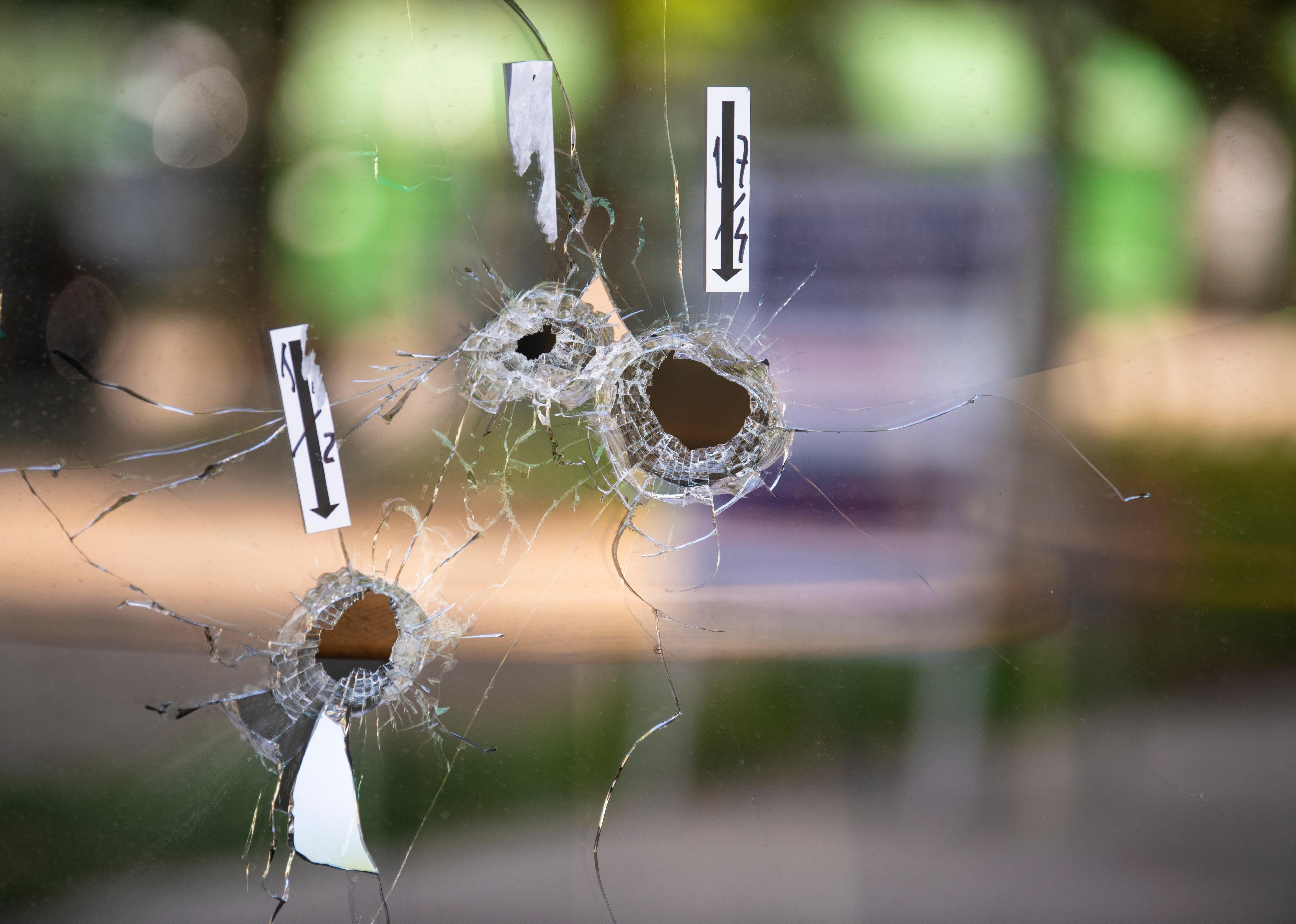 Bullet holes on the window of local restaurant.