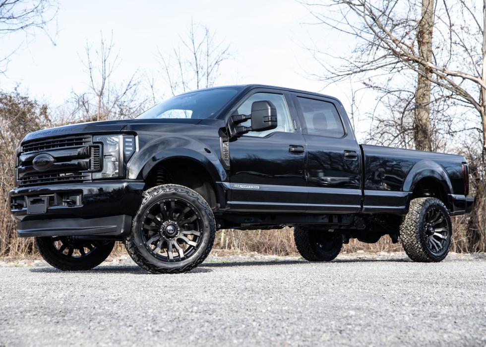 A black Ford pickup truck parked outside.