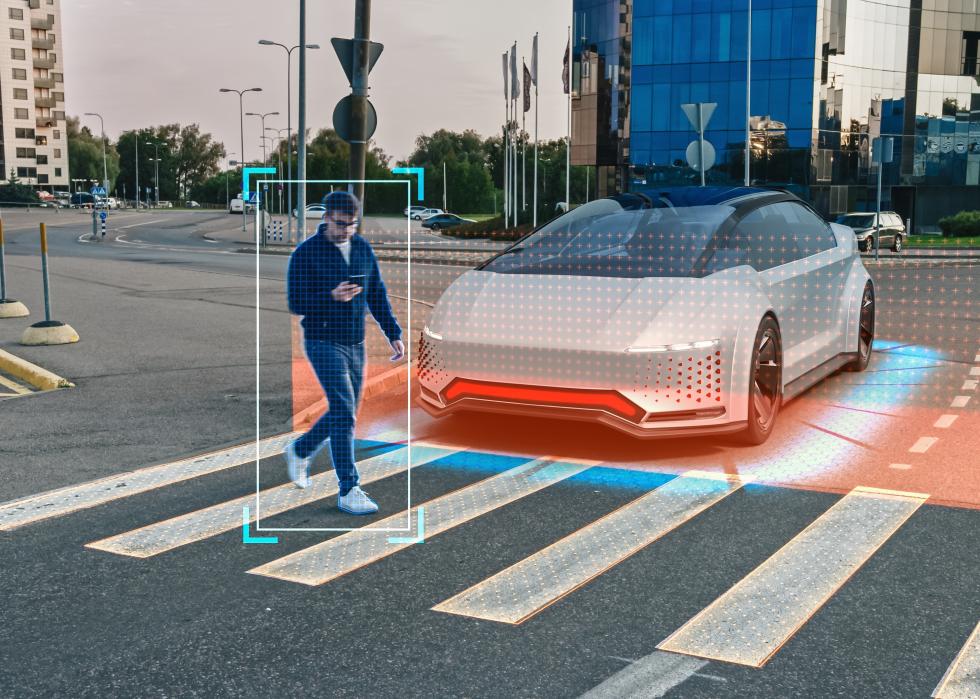 Self-Driving car with a person on a crosswalk.