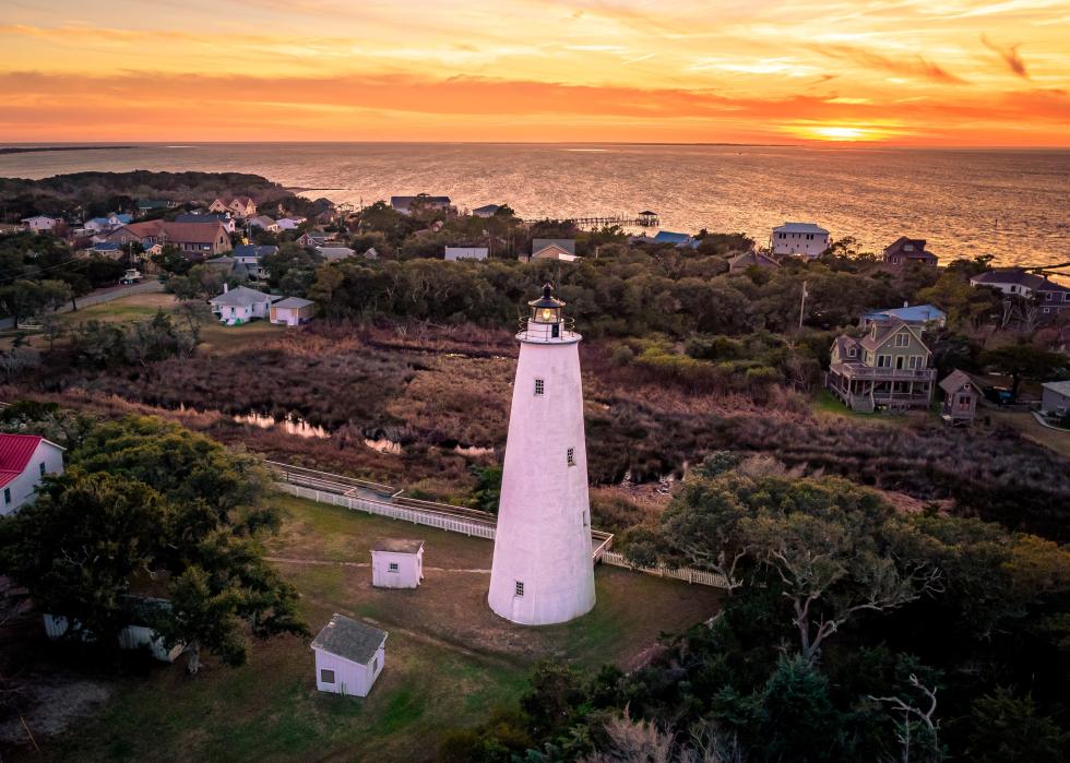Sunset and aerial of a lighthouse.