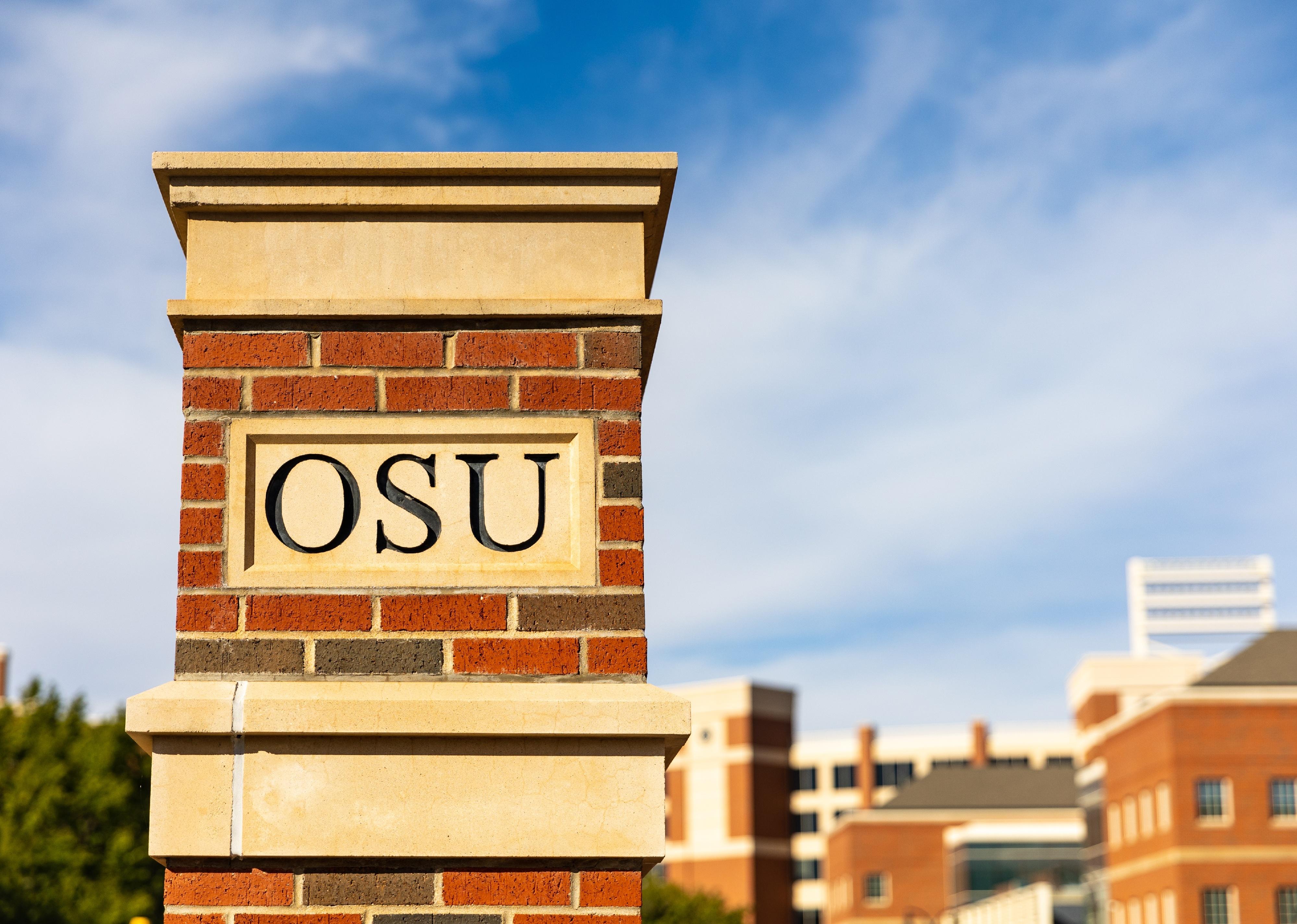 OSU Lettering on brick column on the Oklahoma State University Campus.