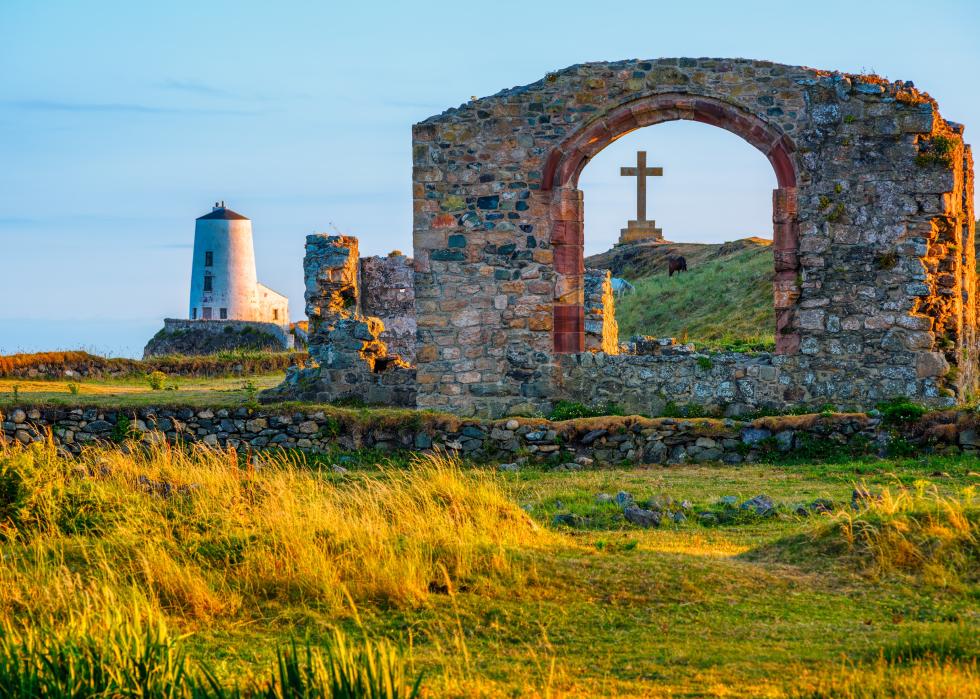 Twr Mawr Lighthouse and the ruins of historical St Dwynwen's Church.
