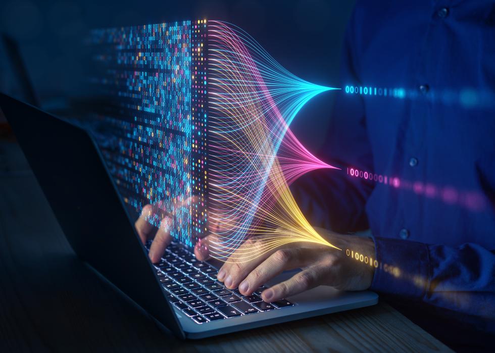 Scientist analysing complex data set on computer.