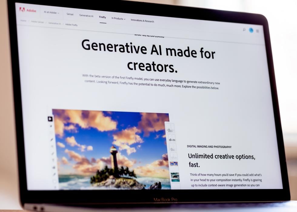 Adobe Firefly website displayed on Mac laptop screen.