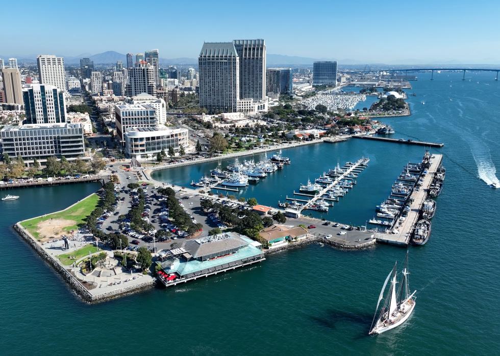 A high-angle view of Tuna Harbor in San Diego filled with docked sailboats.