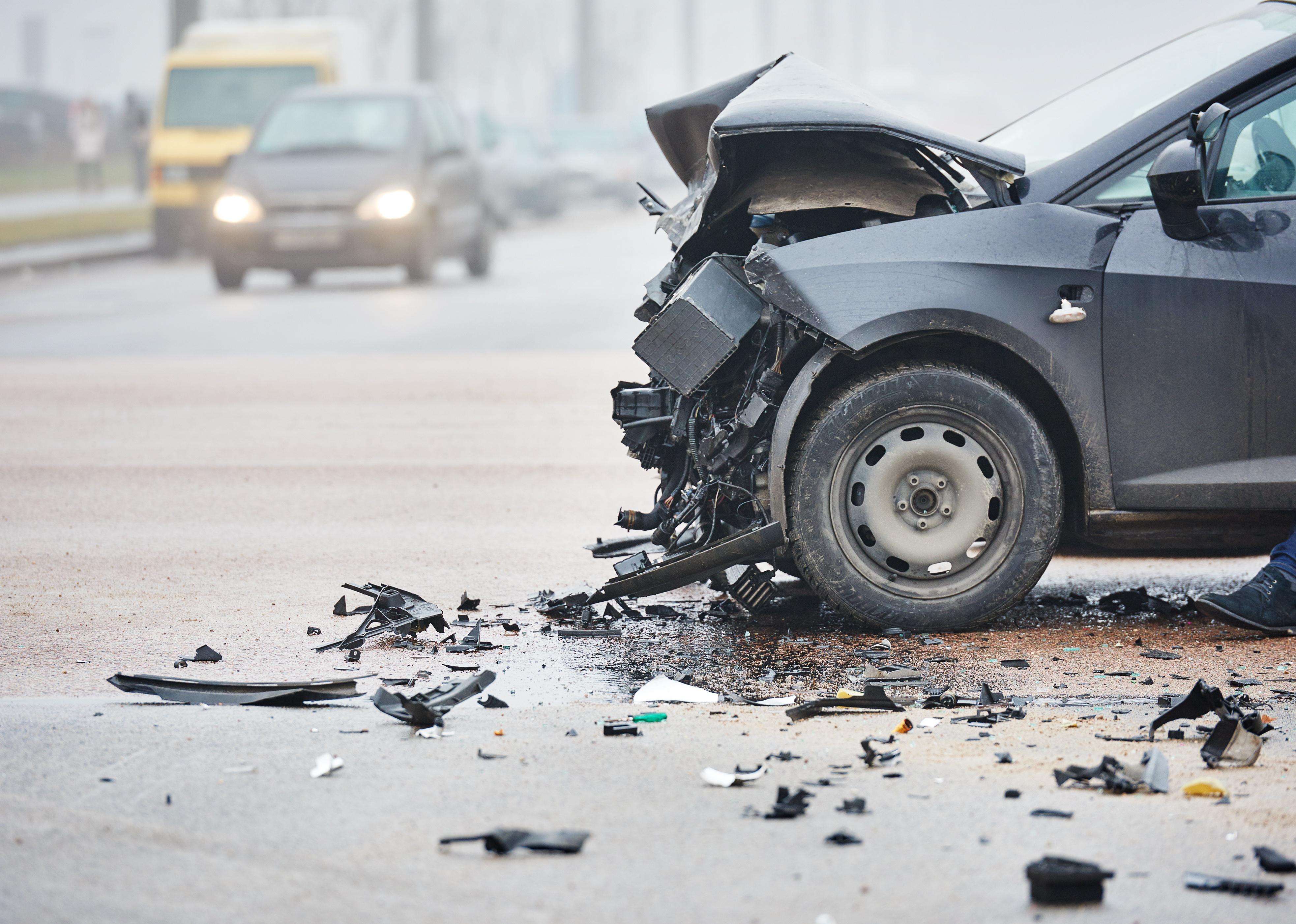 Broken front of a car after a collision.