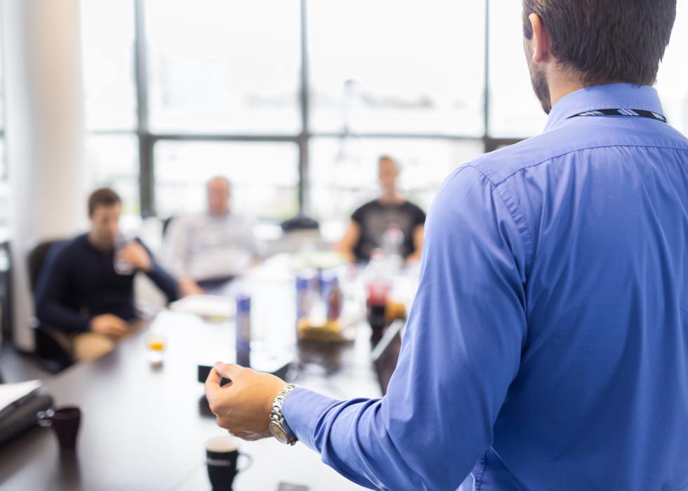 Businessman giving a presentation at office.