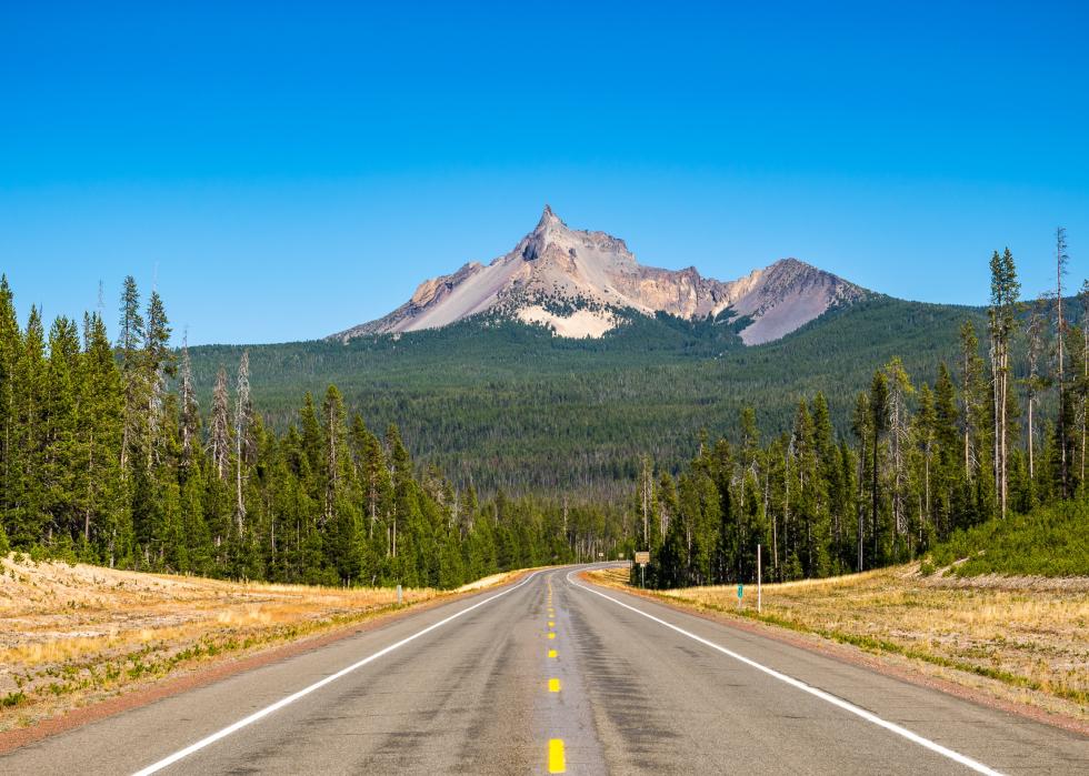 Road to crater lake with scenic view of Mt Thielsen.