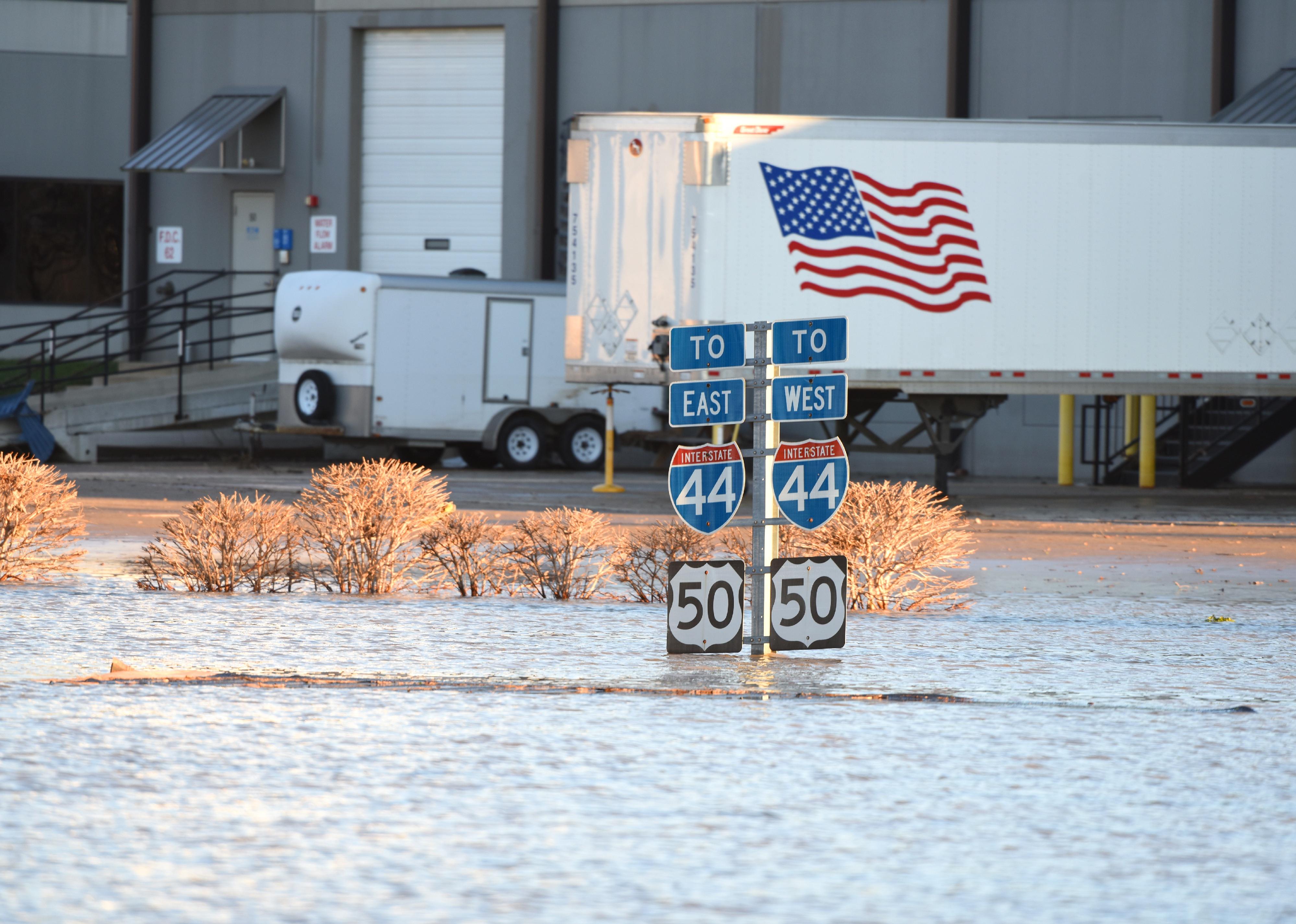 Flood waters submerge highway signs in Valley Park, Missouri.