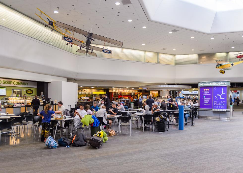 People seated waiting at San Francisco International Airport.