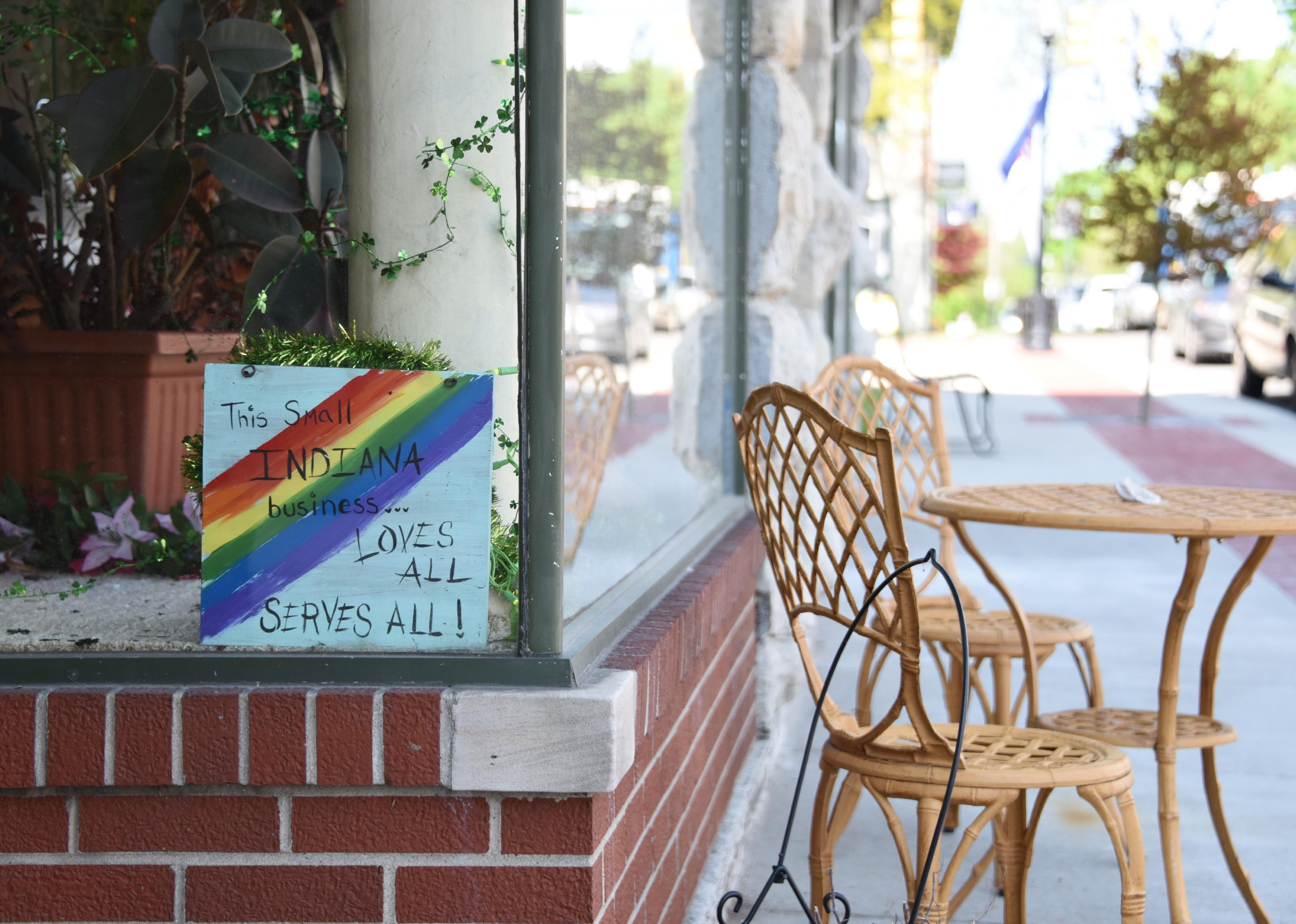 Small business with sign that everyone is welcome.