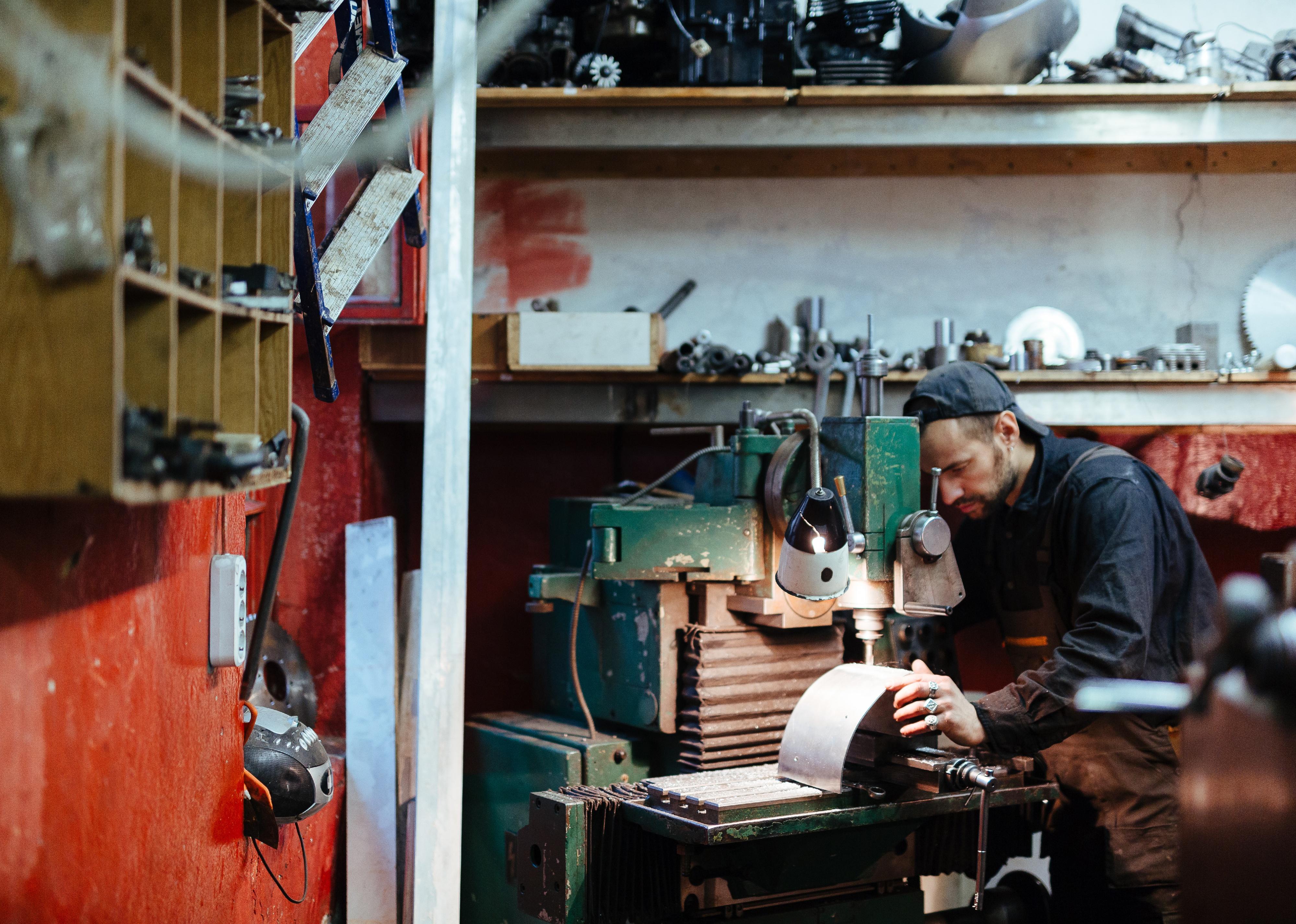 Technician working with metal.