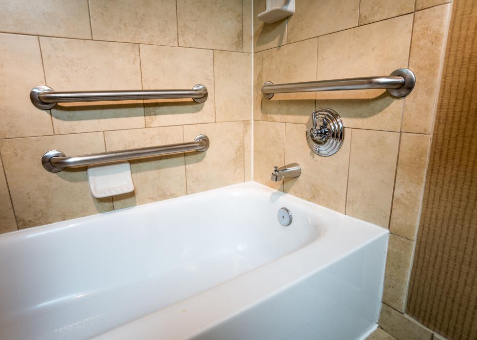 Handicap bathtub with hand rails.