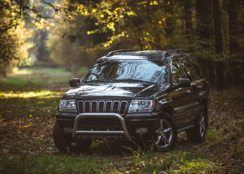 Jeep Grand Cherokee in a wooded area.