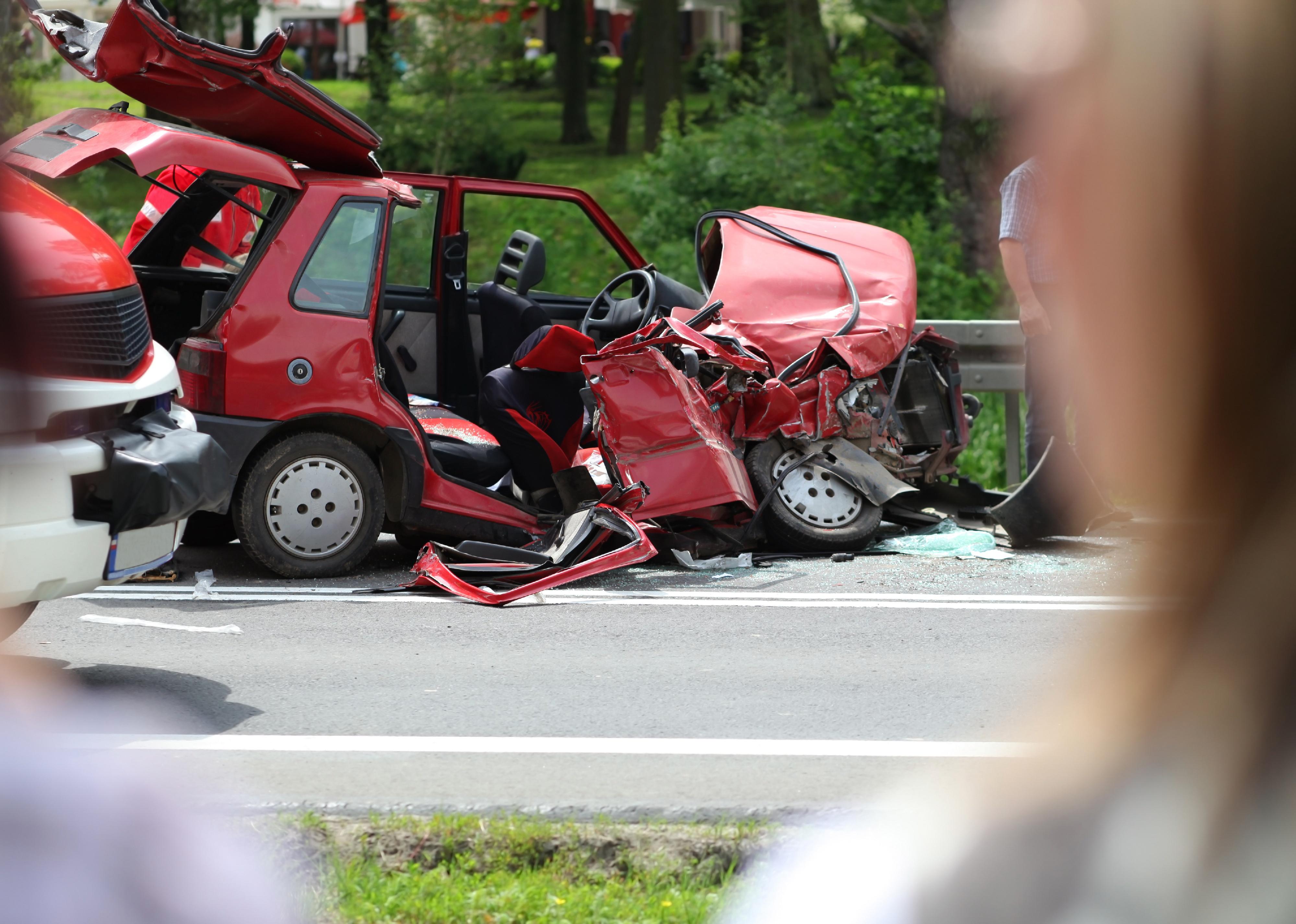 Fatal automobile accident on road, destroyed in a crash.