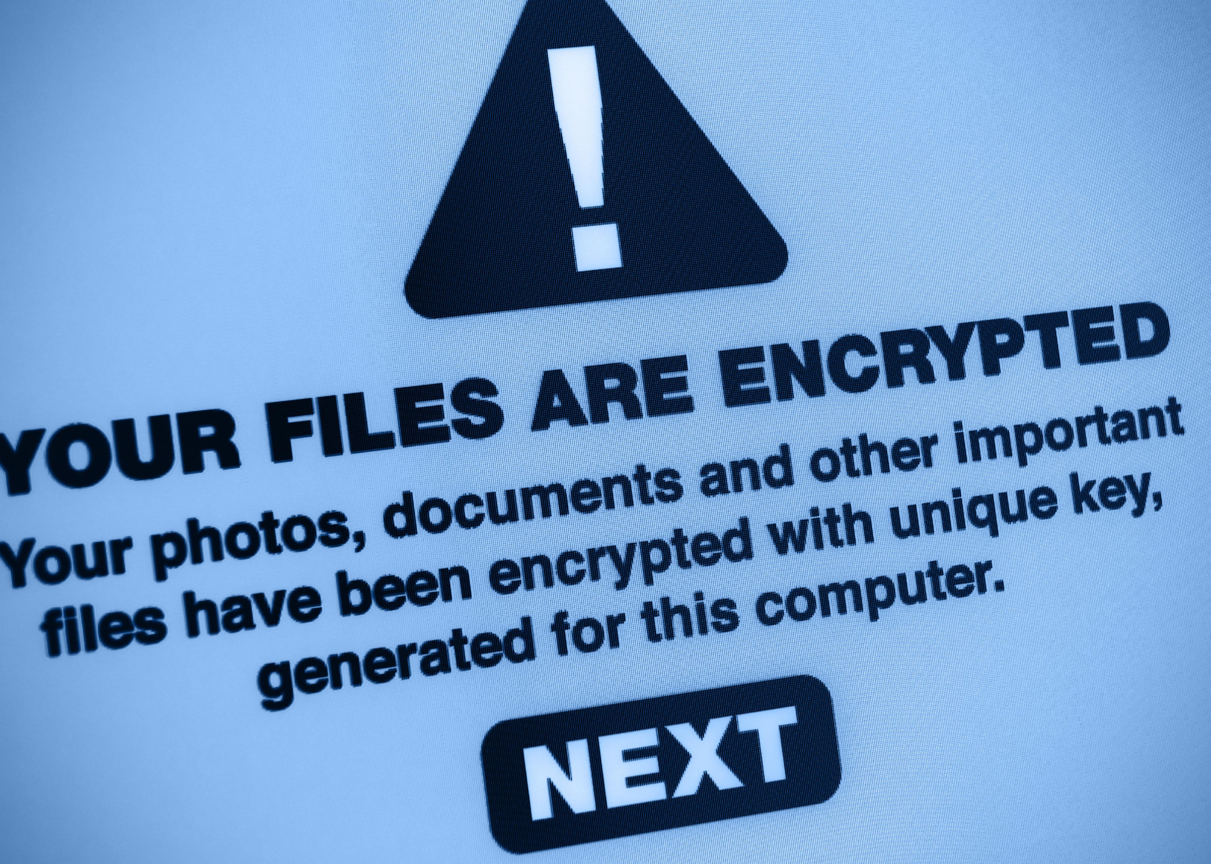 Close up of "Your Files Are Encrypted" warning on a screen