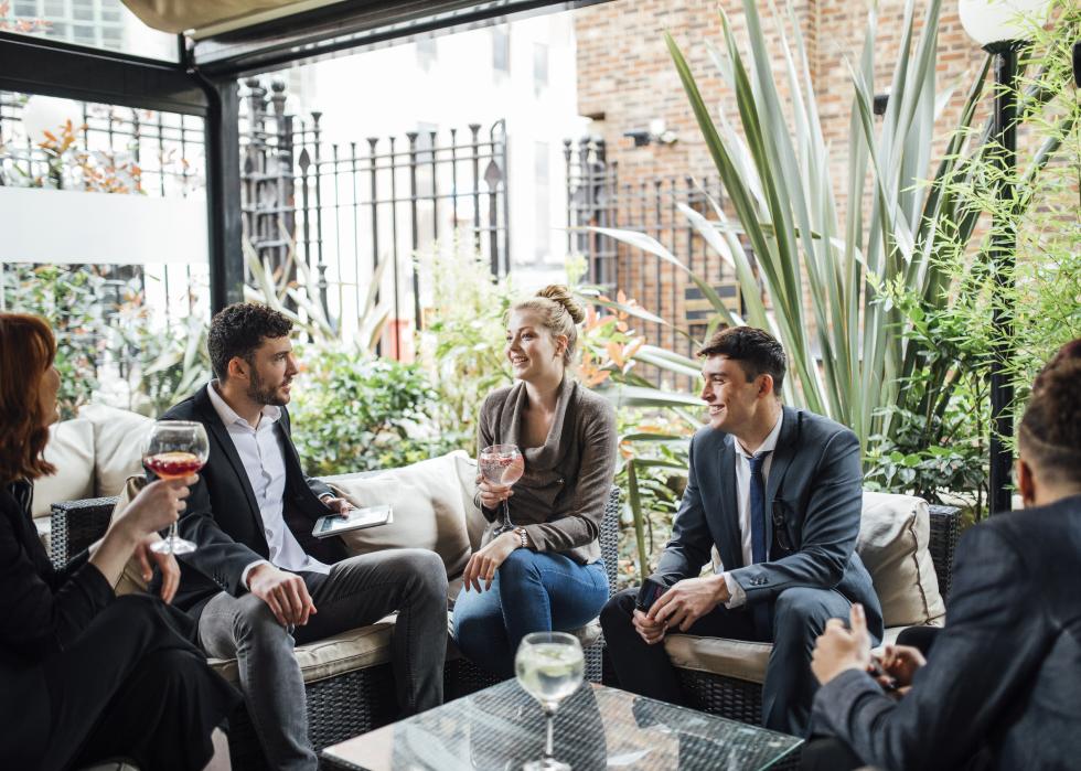 Business people having a meeting in a bar courtyard