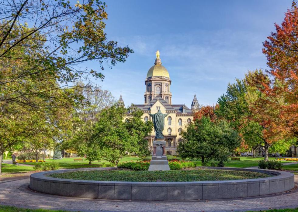 Statue and buildings at University of Notre Dame.