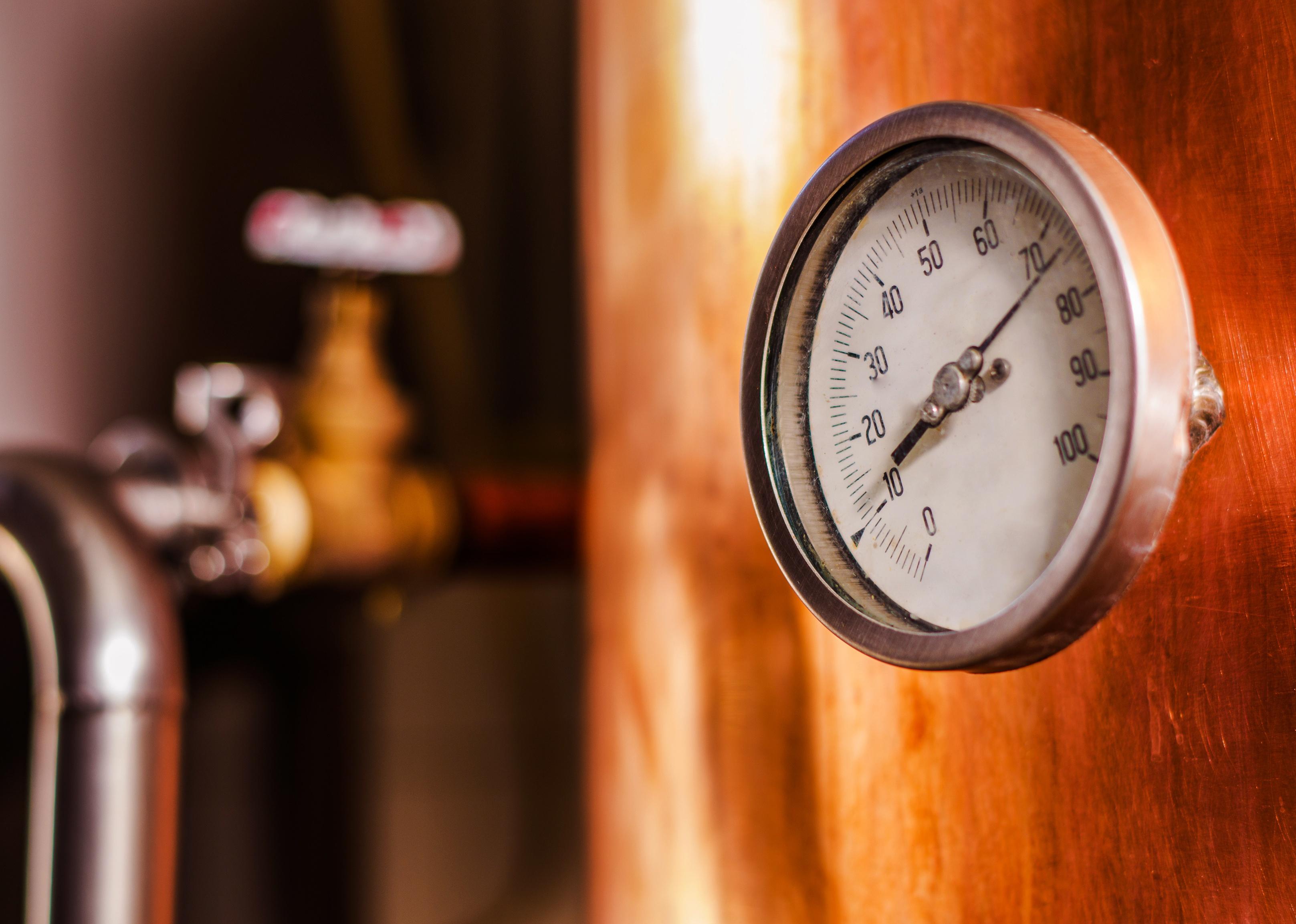 Close up of a pressure gauge inside of a modern beer brewery