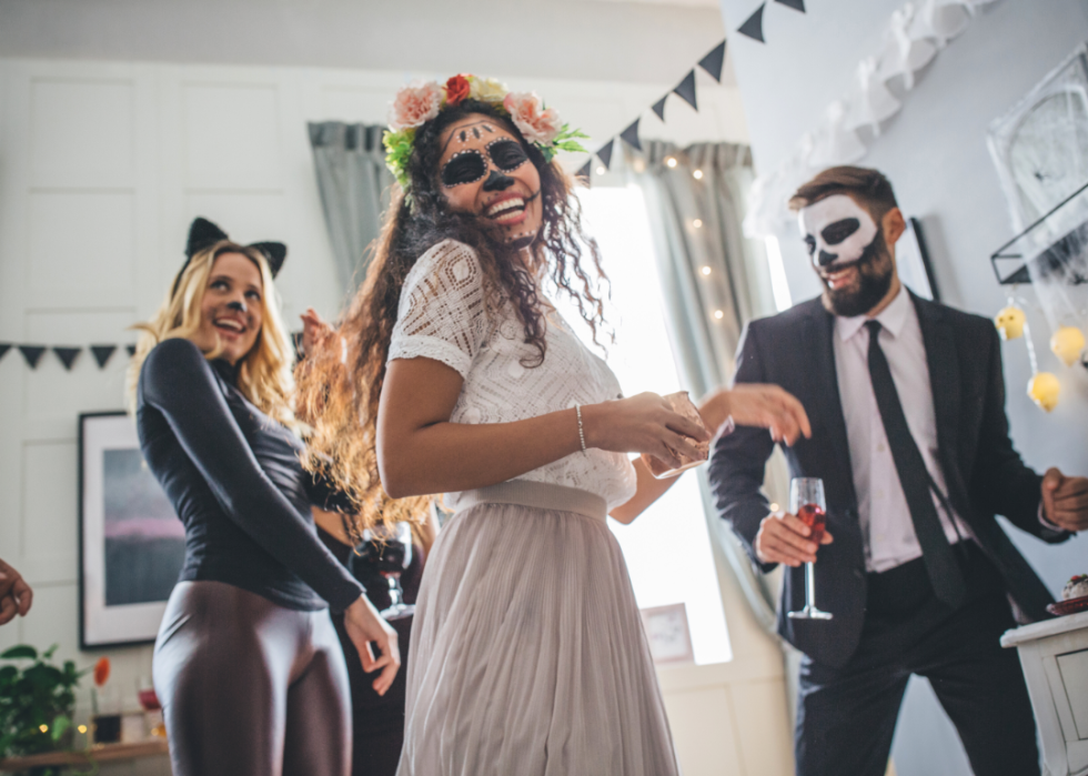 People in costumes dancing.