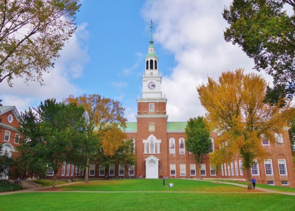 Historic red brick building with clocktower on campus at Dartmouth.