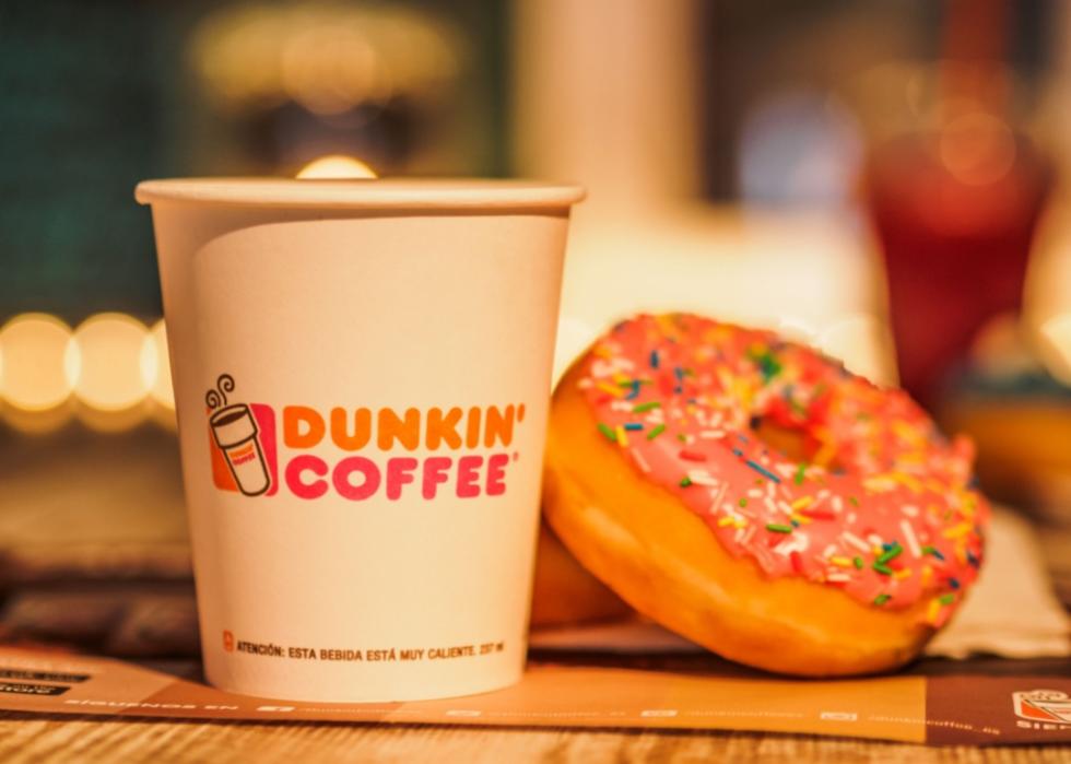 A Dunkin' donut and cup of coffee.