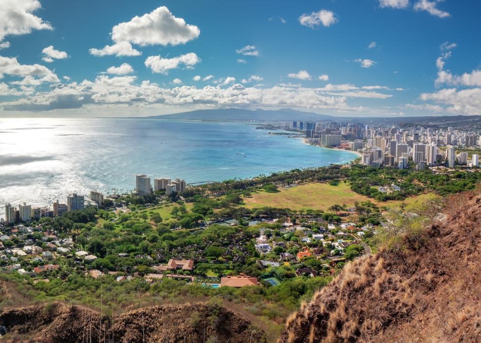 Panoramic view from the Diamond Head crater of the Honolulu cityscape with the Pacific Ocean at the background.