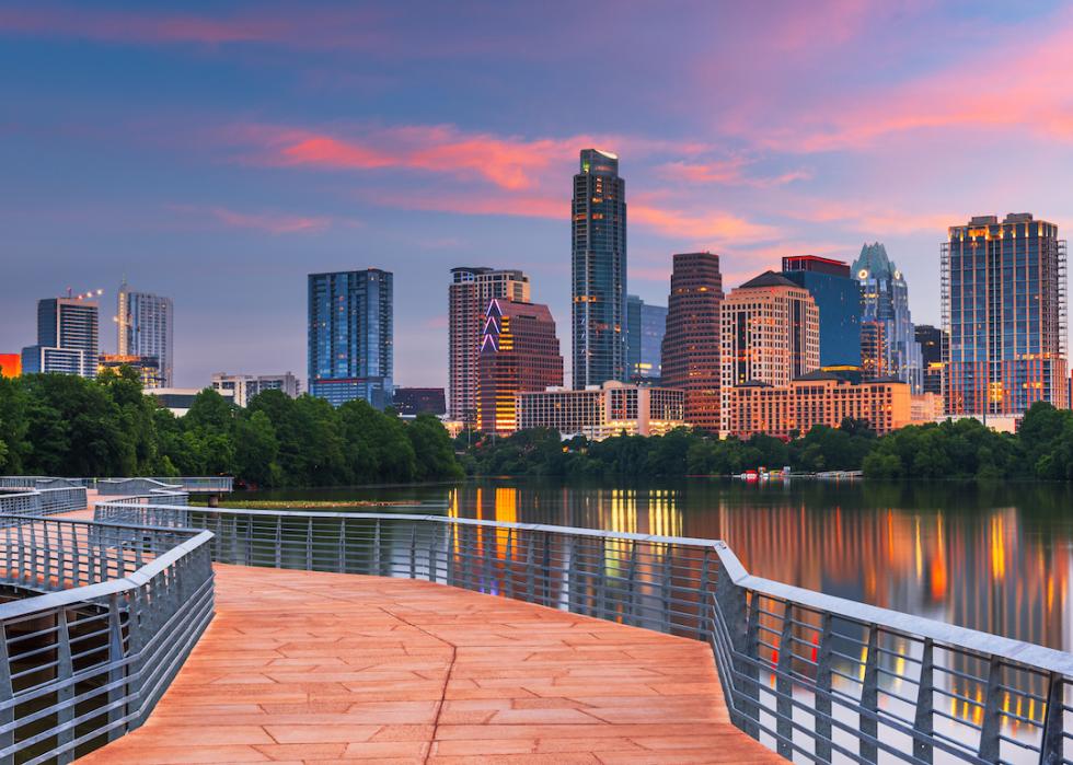 Downtown skyline over the Colorado River at dawn in Austin, Texas.