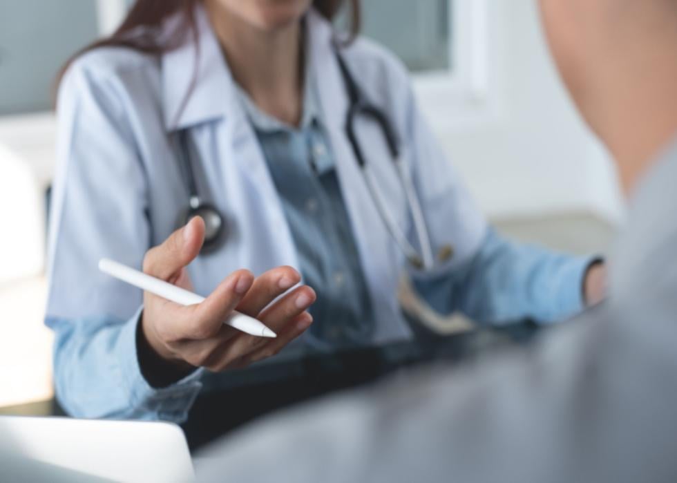 A doctor seated across from a patient.