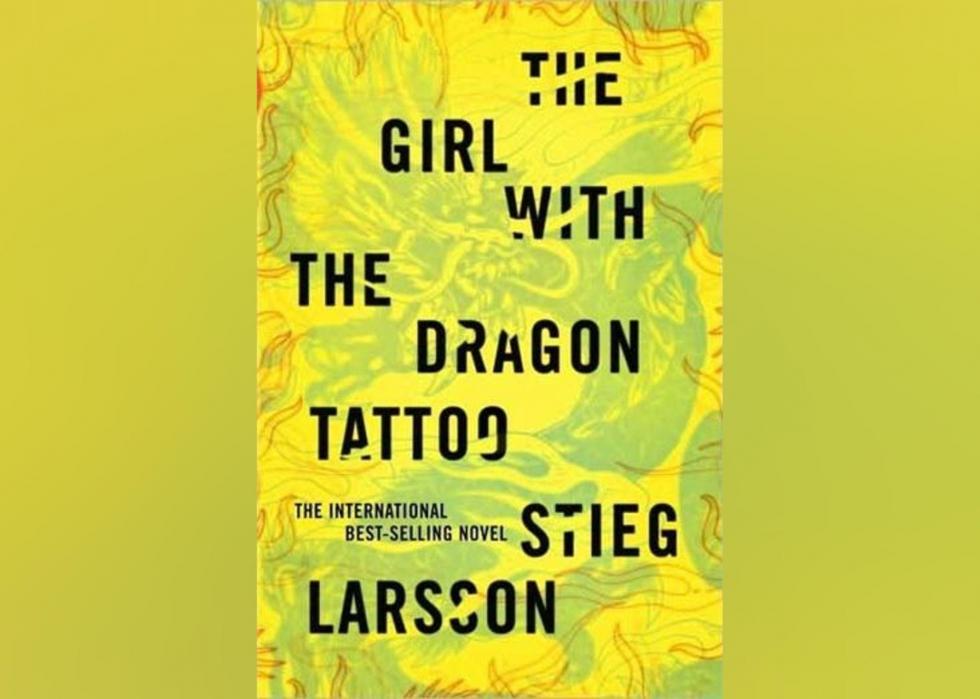 The novel's cover is bright green, yellow and red, with abstract line drawings of dragons. 