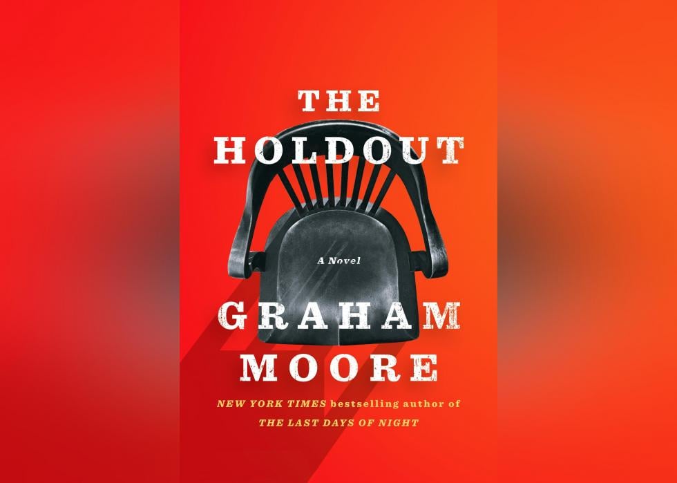 The cover shows a chair from above against a red background.
