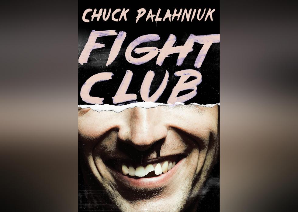 The cover shows the bottom half a man's face smiling, with a broken tooth and a bloody nose. 