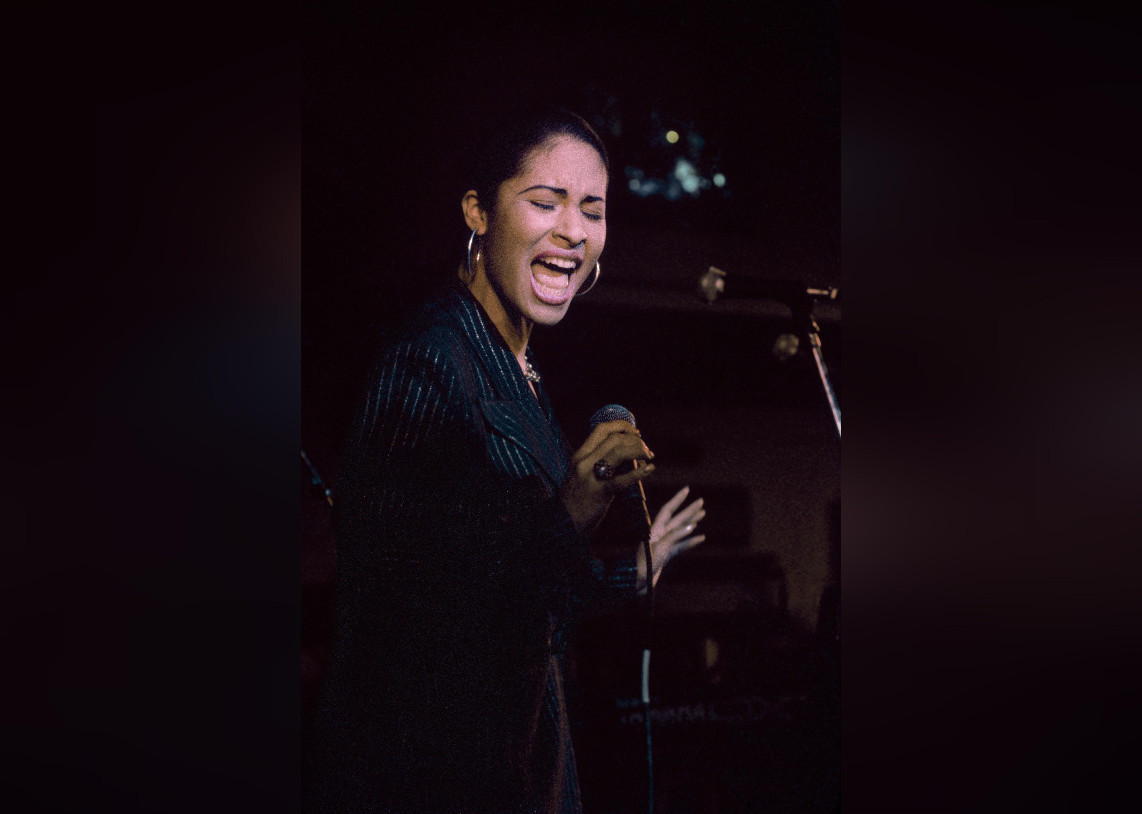 Singer Selena performs at the opening of the Hard Rock Cafe.