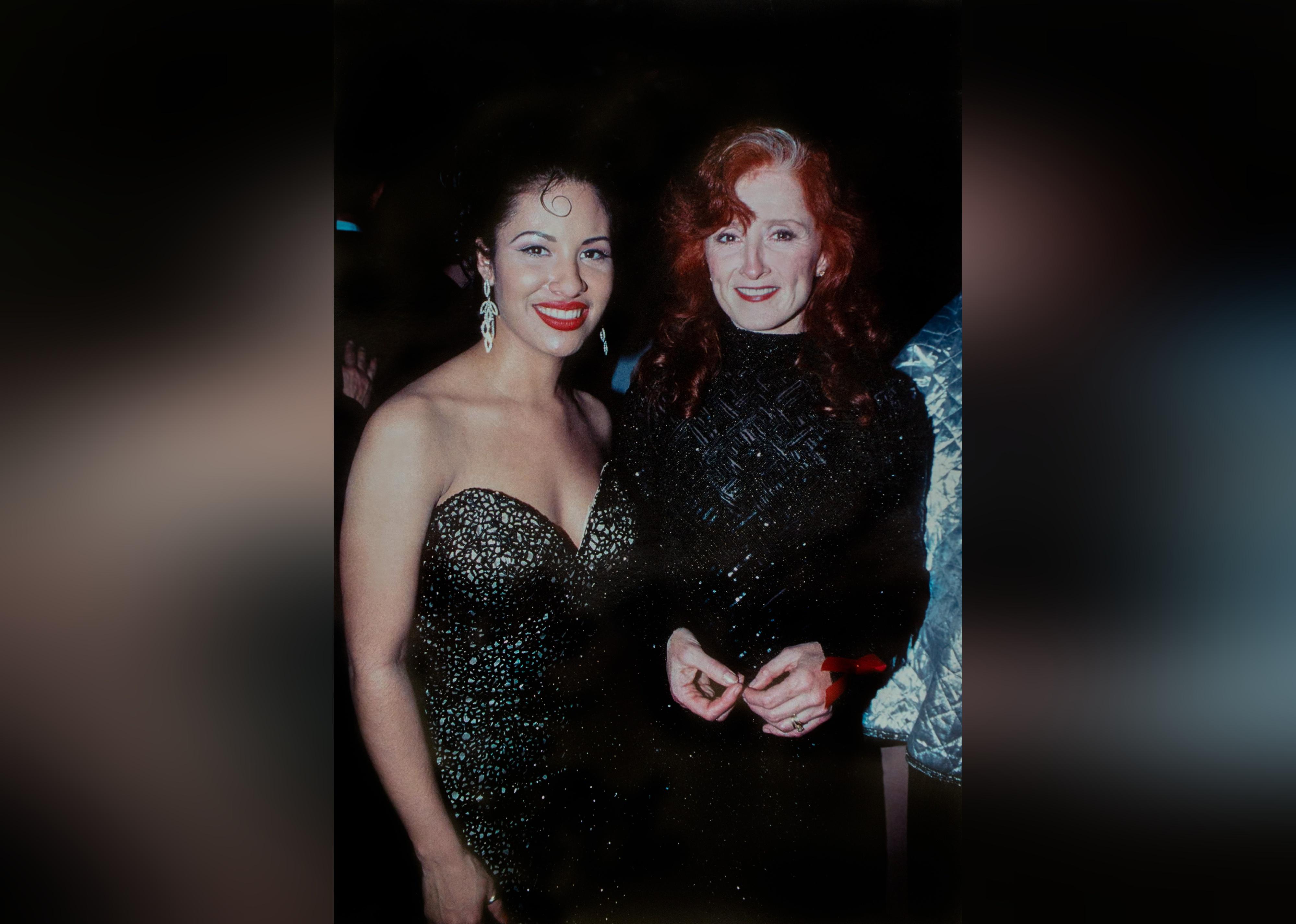 Selena poses with Singer Bonnie Raitt during the EMI records Post-Grammy Party.