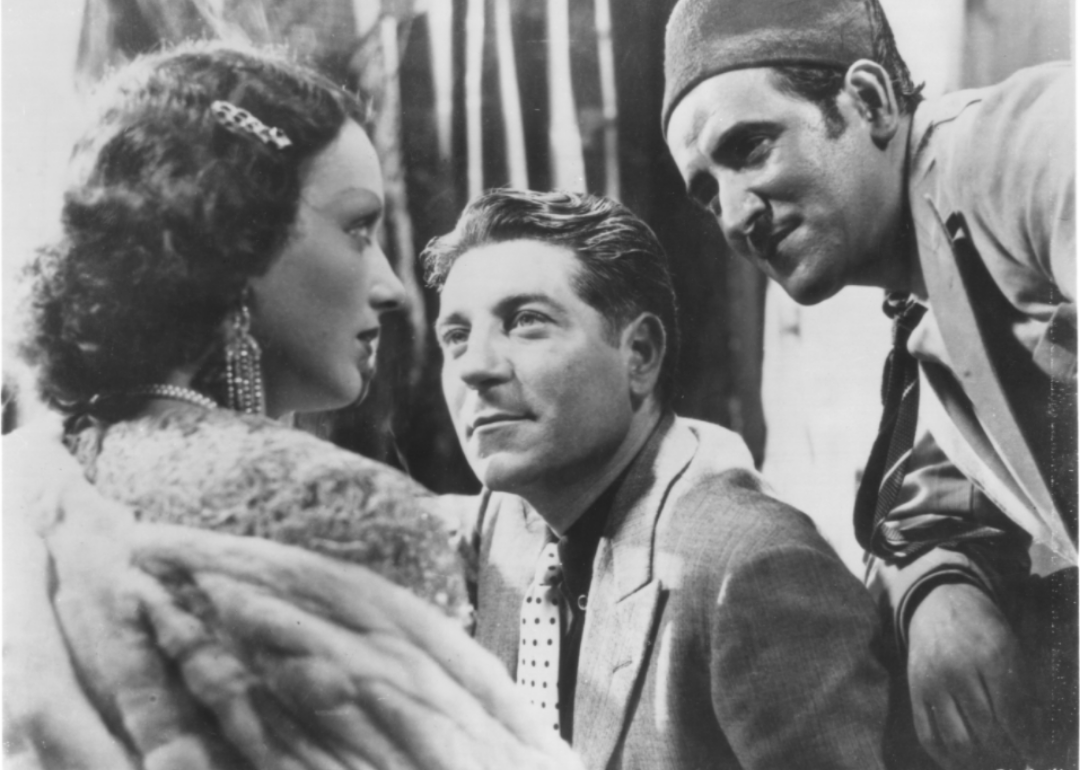 Actors Mireille Balin, Jean Gabin, and Lucas Gridoux in a scene from ‘Pépé le Moko.'