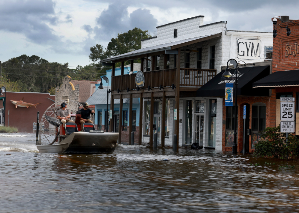 An airboat passes through flood waters in the downtown area after Hurricane Idalia passed offshore on August 30, 2023 in Crystal River, Florida. 