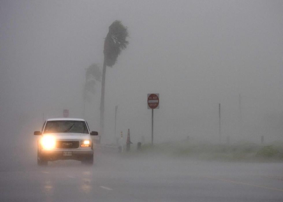 A driver makes their way through high winds and rain July 23, 2008 in San Benito, Texas