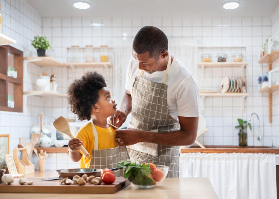 A father and son cooking together