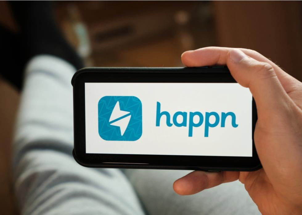 A man using the Happn application on his smartphone