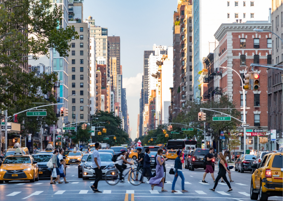 People cross the street in the East Village of Manhattan, New York.