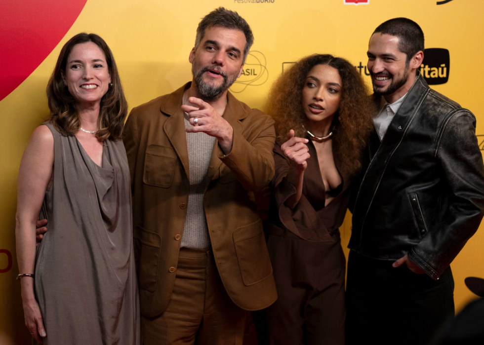 French film producer Emilie Lesclaux, Brazilian actor Wagner Moura, actress Alice Carvalho, and actor Gabriel Leone pose for a photo at the gala premiere of the film 'The Secret Agent' during the 27th Rio Film Festival at Cinema Odeon in Rio de Janeiro
