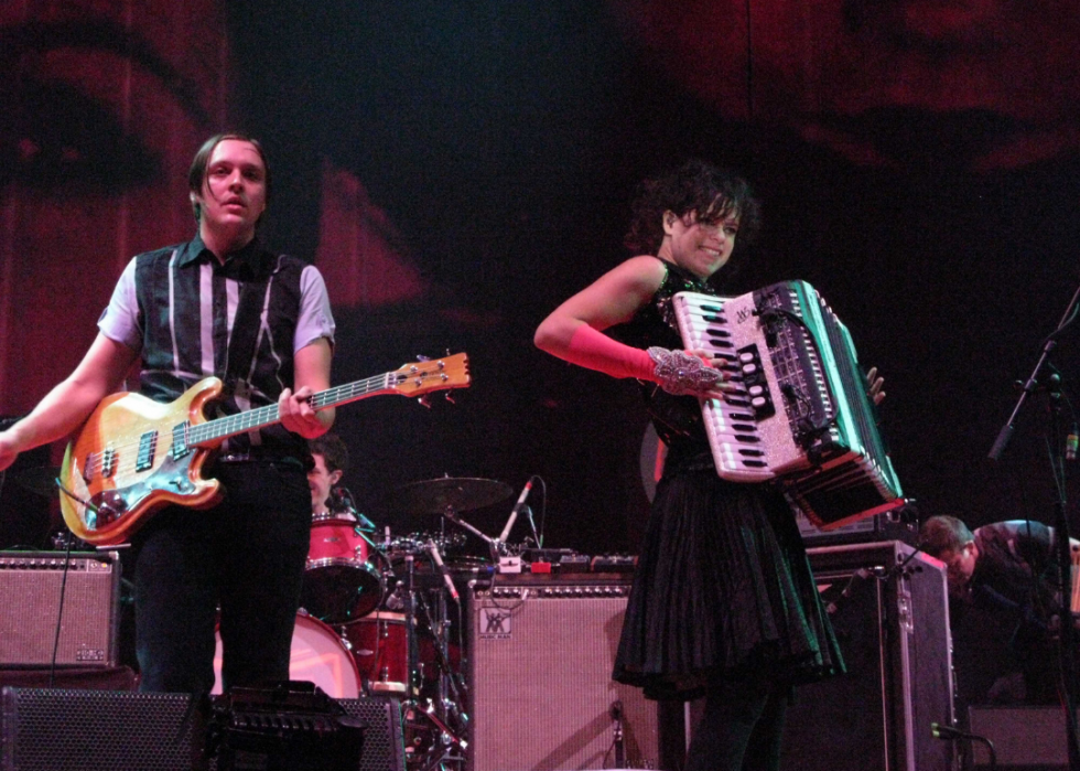 A guitarist and accordion player perform. 